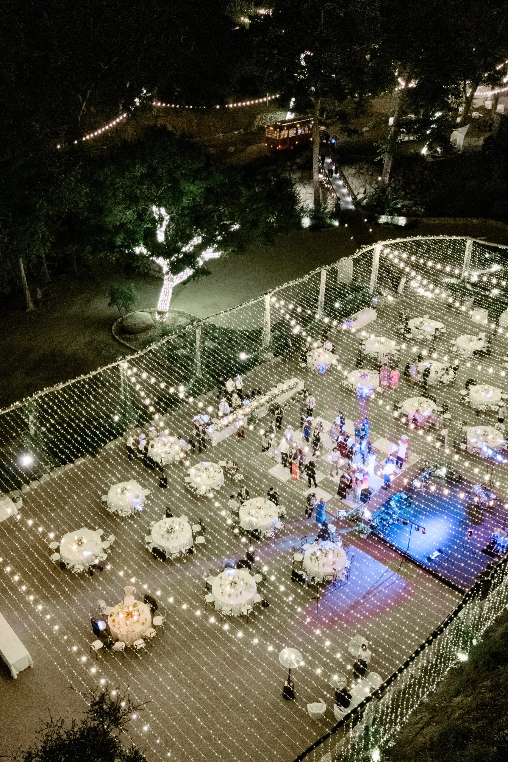 The Piazza after dark — string-lit dance floor and tables seen from above